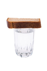 Mug with vodka and bread for mourning, concept isolated on white background