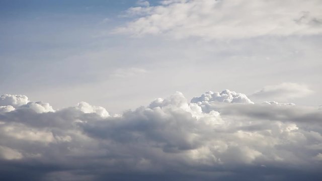 Timelapse of cumulus clouds forming on a clear blue sky