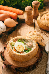 Traditional polish  soup - zurek, served in bread loaf.