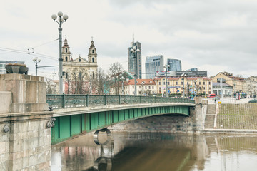 Naklejka premium View of Neris river with Green bridge and the Church of the St Raphael the Archangel, Vilnius, Lithuania.