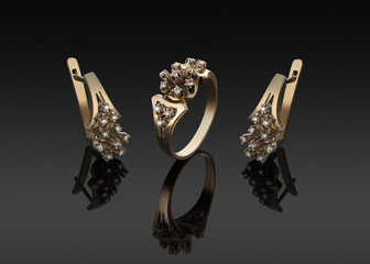 gold ring and earrings with diamonds