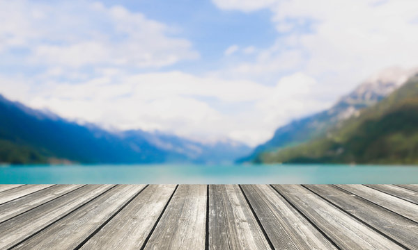 Wood table top and blurred lake & mountain background - can used for display or montage your products.
