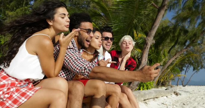 People Group Take Selfie Photo On Cell Smart Phone Outdoors Under Palm Trees On Beach Slow Motion 60