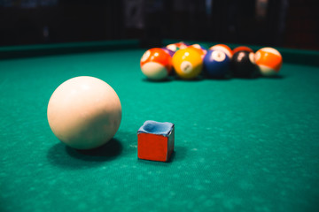 Ball and chalk on the billiard table
