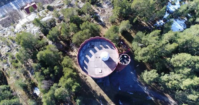 Halikko watertower, Cinema 4k aerial view of coming down above Halikko water tower, on a sunny spring day, in Salo, Finland