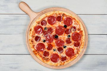 Delicious italian pizza served on wooden table
