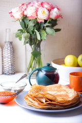 Traditional Russian pancakes with caviar and sour cream. Maslennitsa. Selective focus
