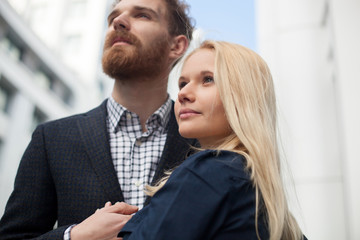 Man and woman looking into the distance