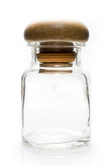 Glass bottle with wooden Lid on White background