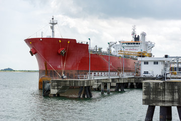 Large liquid cargo vessel docked at the jetty near Tanjung Langsat Port, Johor, Malaysia.