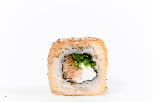 Japanese cuisine. One peace of sushi roll isolated on white background