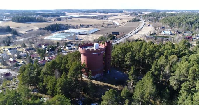 Halikko watertower, Cinema 4k orbit aerial view of Halikko water tower, on a sunny spring day, in Salo, Finland
