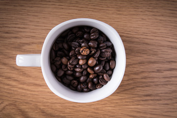 coffee beans and cup full of coffee