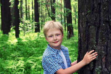 Child hugging tree