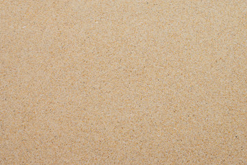 closeup of sand background pattern of a beach in the summer