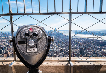 coin operated binoculars on top of the Empire State building, overlooking Manhattan