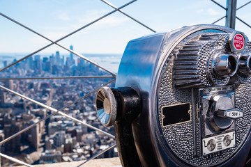 coin operated binoculars on top of the Empire State building, overlooking Manhattan