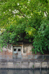 Fototapeta na wymiar Exterior view of vintage house at riverside