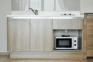 Fototapeta na wymiar Contemporary kitchen design interior with wood and stainless steel material