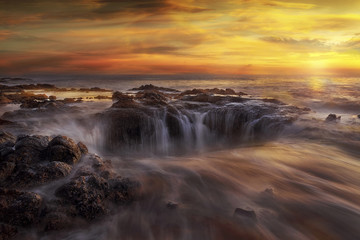 Thors Well at Oregon Coast at fiery sunset 