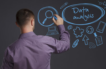 Business, Technology, Internet and network concept. A young businessman writes on the blackboard the word: Data analysis