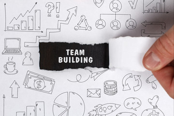 Business, Technology, Internet and network concept. Young businessman shows the word: Team building