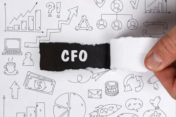 Business, Technology, Internet and network concept. Young businessman shows the word: CFO