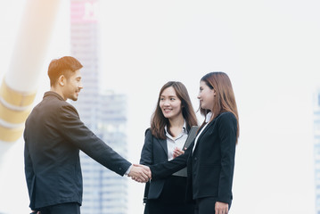 Businessman and Businesswoman Shaking Hands, finishing up a meeting of the trade negotiations,finance, banking or sales,Successful business concept