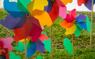 Multicoloured windmill toys in the garden