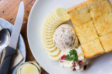 Toast and ice cream and banana dessert in cafe