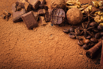 Chocolate truffle,Truffle chocolate candies with cocoa powder.Homemade fresh energy balls with chocolate.Gourmet assorted truffles made by chocolatier.Chunks of chocolate and coffee beans,copy space