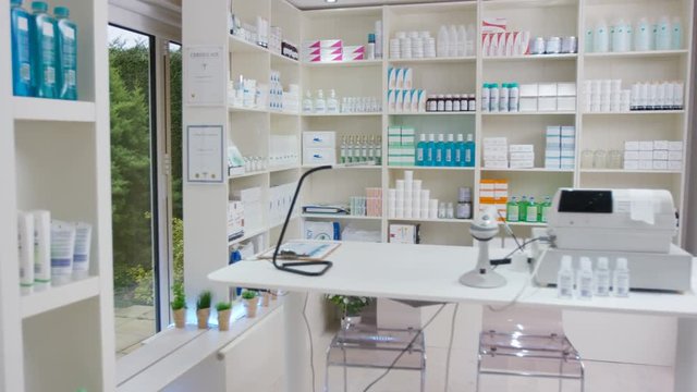  Interior view of a modern chemist shop. No people.