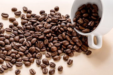 Coffee cup and coffee beans on table