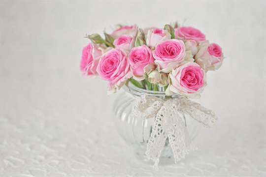 Beautiful pink roses flowers in a vase . 