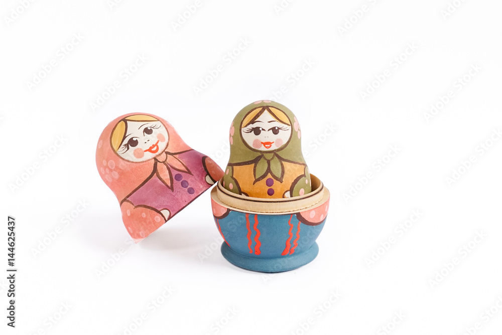 Wall mural Russian dolls babushka (or matreshka) or Colorful Russian nesting dolls isolated on a white background. Russia nesting doll is a very popular souvenir, locally made.