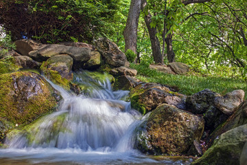 Small artificial waterfall in a public park
