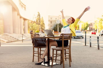 Successful Businesswoman On A Break In A Street Cafe