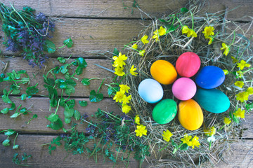 Multicolored easter eggs on a wooden.