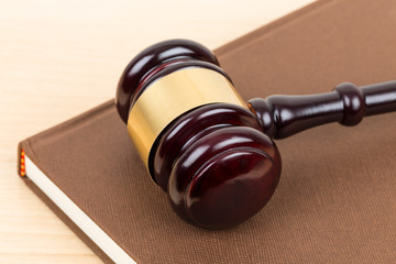 Wooden judge gavel and book