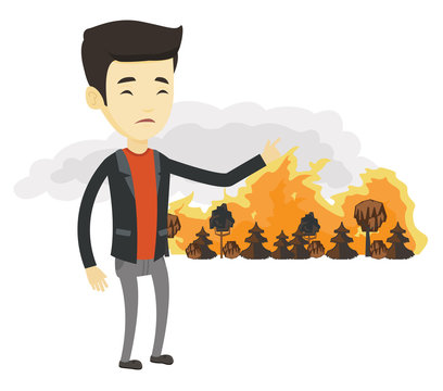 Man standing on the background of wildfire