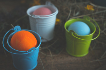 Multicolored easter eggs on a wooden.