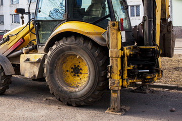 yellow tractor on the street
