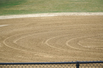 Fototapeta na wymiar plowed baseball playing field in the park