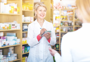Laughing woman recommending skin care products