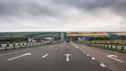 Landscape with countryside highway at summer in Russia.