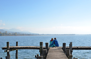 A couple on the wooden jetty
