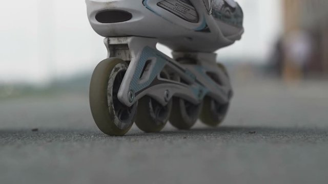 Rollers stand on asphalt. Close up shot