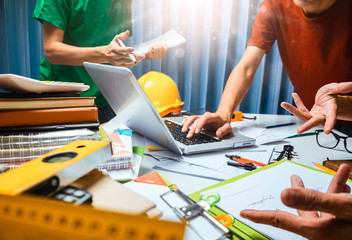 Teamwork of business man contractor working meeting in the office construction site on their...