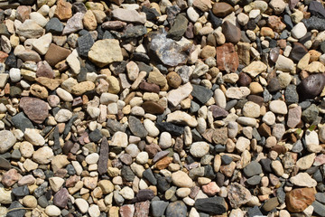 Background with detail of gravel pavement in the garden. 