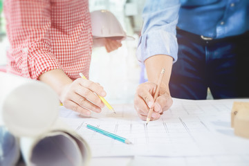 Image of engineer meeting for architectural project. working with partner and engineering tools on workplace